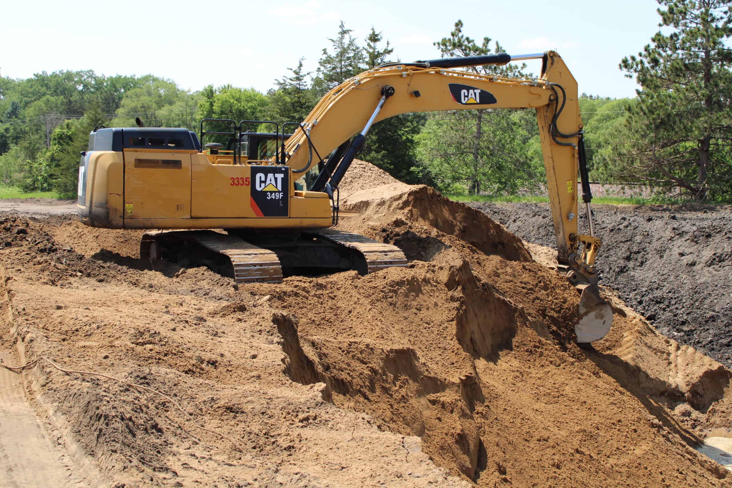 Jordan, MN 2 Excavator on Jordan Jobsite Digging In Hole