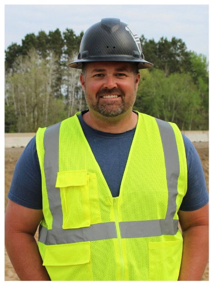 MAY 2025 Newsletter (Real Estate Flyer)-2 smiling worker