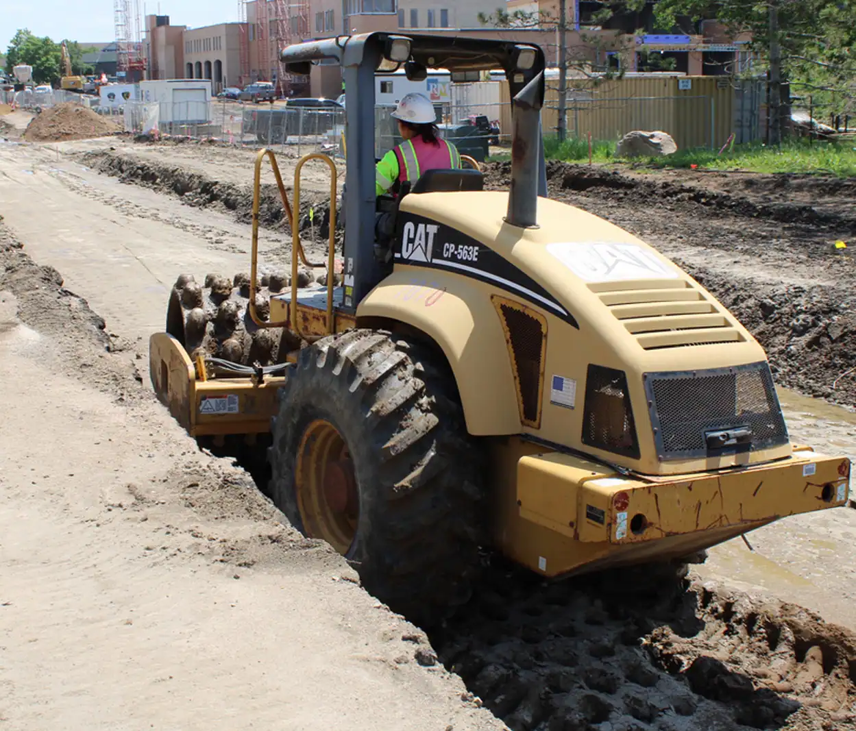 melanie-gallardo Melanie operating a sheepsfoot roller at a construction site.